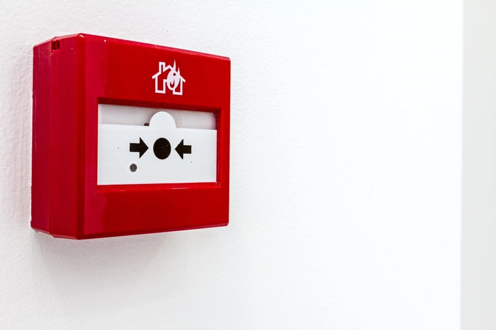A red fire alarm box on the wall