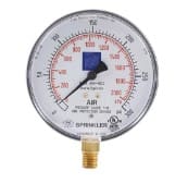 Round air pressure gauge with a needle.