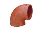 Red 90-degree pipe fitting for plumbing.