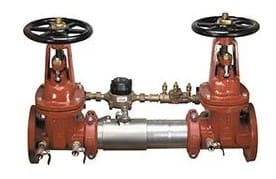 Double check valve with pressure regulating device.