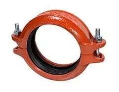 Orange cast iron pipe coupling with bolts.