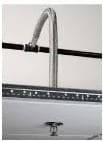 A chrome faucet with a gooseneck spout.