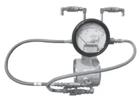 A flow meter with a dial gauge.