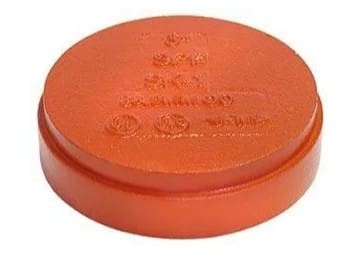 Orange round plastic cap with logos.