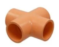 Orange plastic four-way pipe connector.